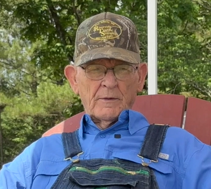 Army Veteran Mr. Robert Pyron sitting outside his new Purple Heart Homes tiny home.